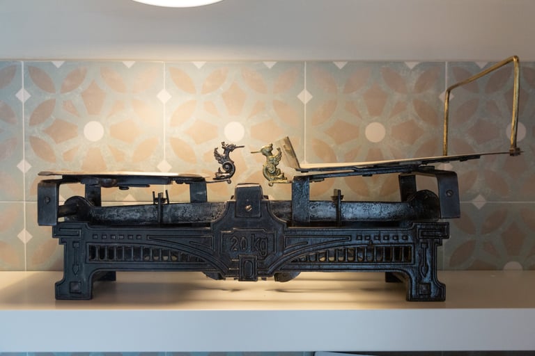 Antique cast iron scale used as a decorative detail in Villa Skyphos kitchen