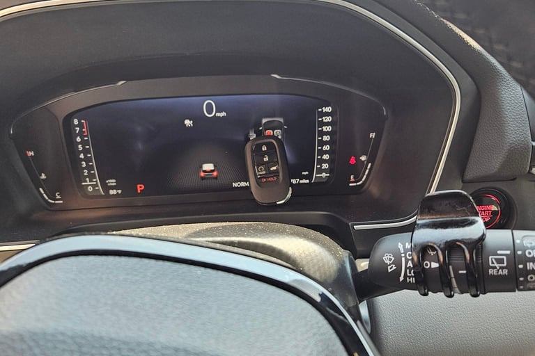 Interior of 2024 Honda Pilot with a programmed key by locksmith on the dashboard in Arden, NC