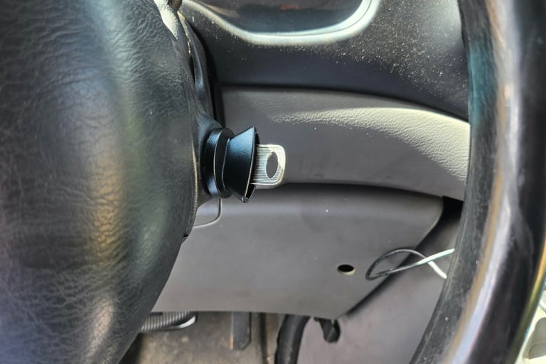 Close up of a key in an ignition representing ignition repair by local locksmith of Arden, NC