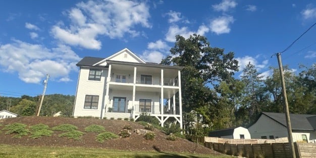 White modern home off of Main Street representing residential locksmith in Weaverville, NC,  including lockouts & key copying