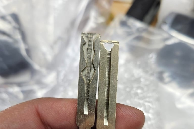 Two house keys side by side for residential key duplication service