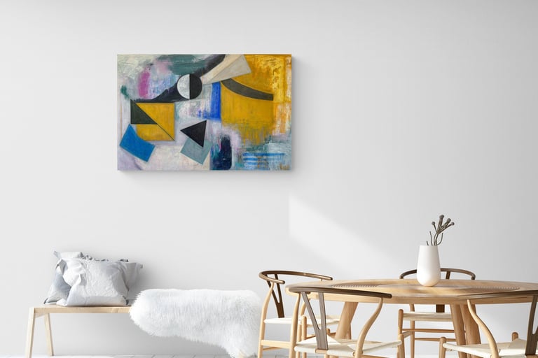 Painting with geometrical shapes in tan and black, blue on wall in white dining room