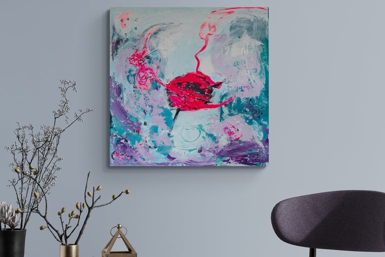 Neon pink and teal painting on wall next to chair.