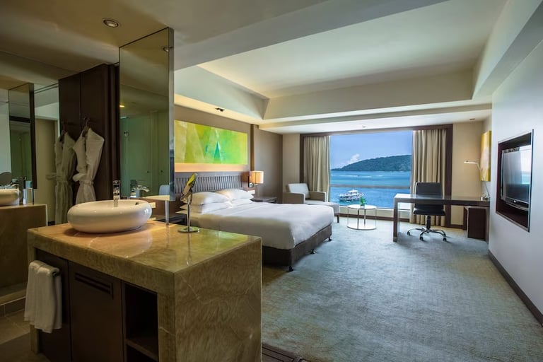 King bed with sea view room at Hyatt Regency Kinabalu