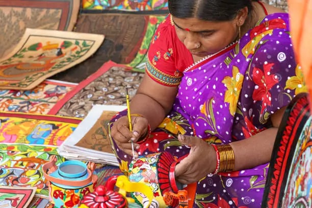 Madhubani art featuring peacocks and Hindu deities.