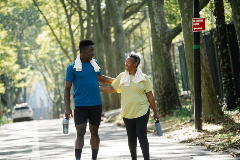 a man and woman walking down a street