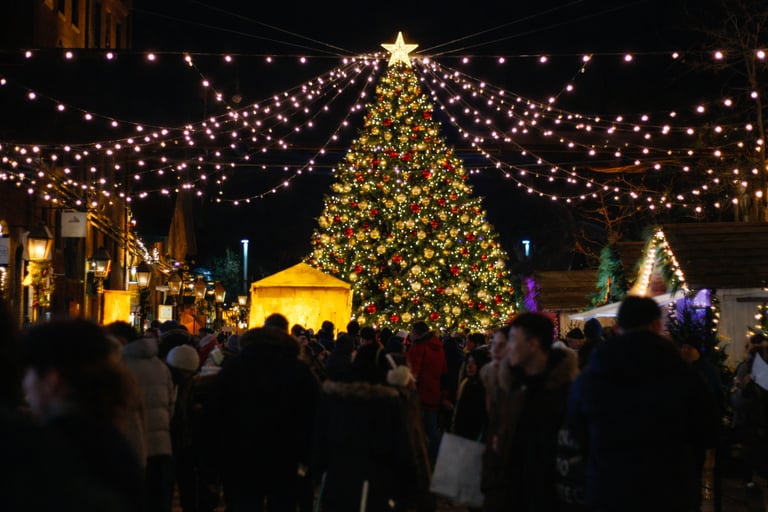 Slow living journal scene of people gathered outdoors under festive lights