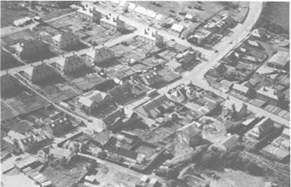 a black and white photo of a city street scene