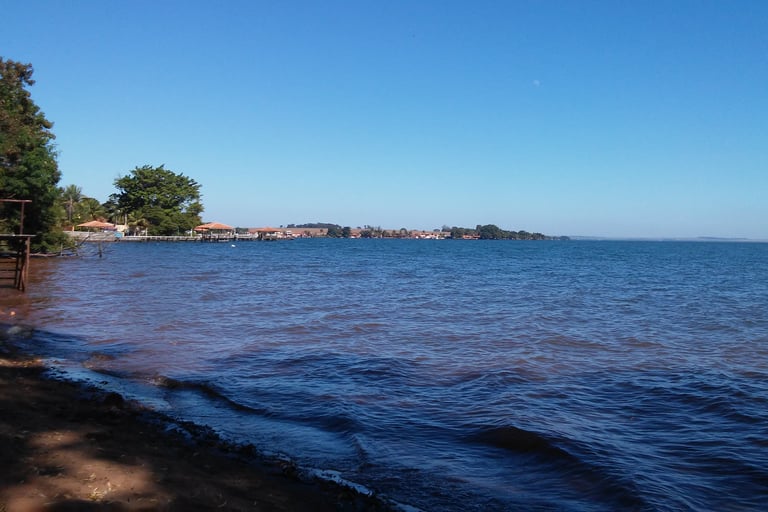a beach with a boat in the water