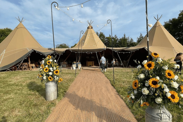 Wedding tent outside with sunflowers