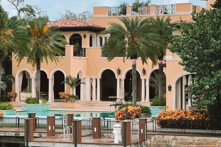 a large house with a pool and a dock