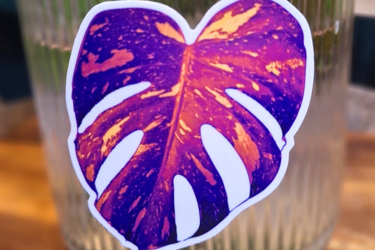 close up of neon vaporwave monstera leaf magnet showing tropical plant design