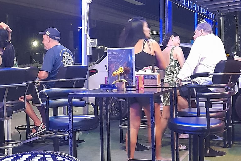 Thai women and customers at bar near Soi 94 in Hua Hin