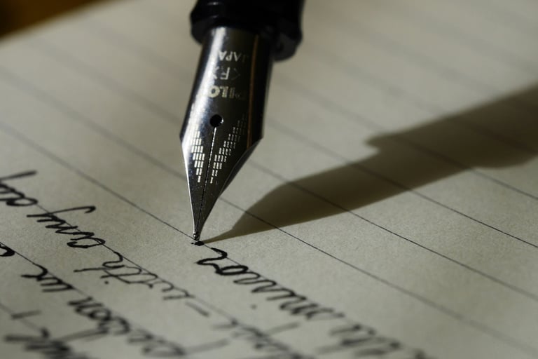 Close-up of a Pilot fountain pen nib writing cursive text on lined paper.
