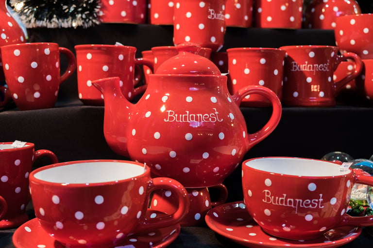 Red and white polka dot ceramic teapot and mugs souvenir set from a Budapest market.
