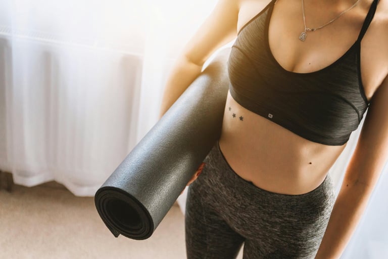Healthy fit woman with yoga mat