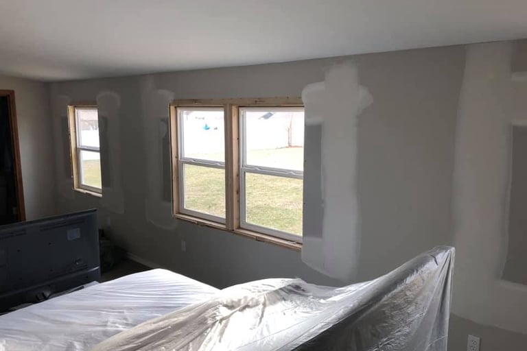 The windows were removed and drywall has been repaired filling in the hole