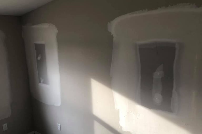 The windows were removed and drywall has been repaired filling in the hole