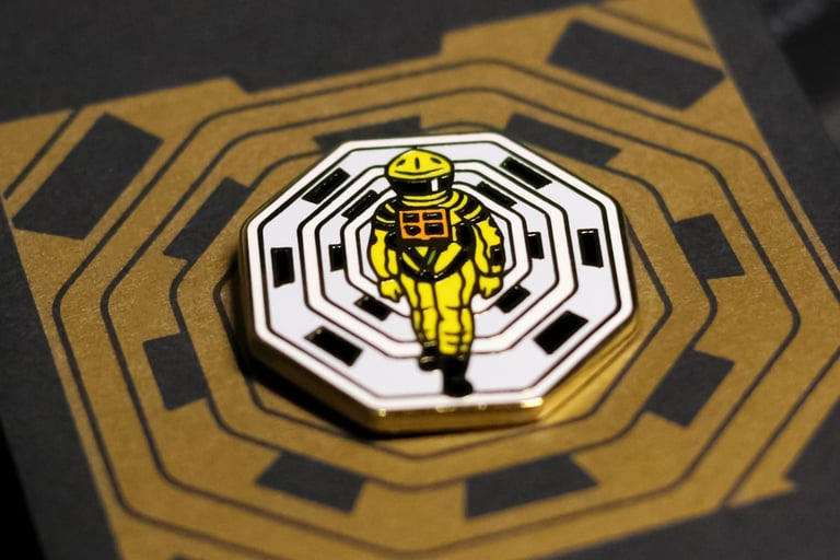 a yellow and black badge with a yellow and white astronaut suit