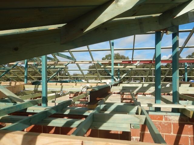 Inspection of a Perth roof frame during a staged building inspection. 
