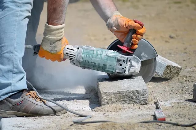 a person using a circular sawdusted machine