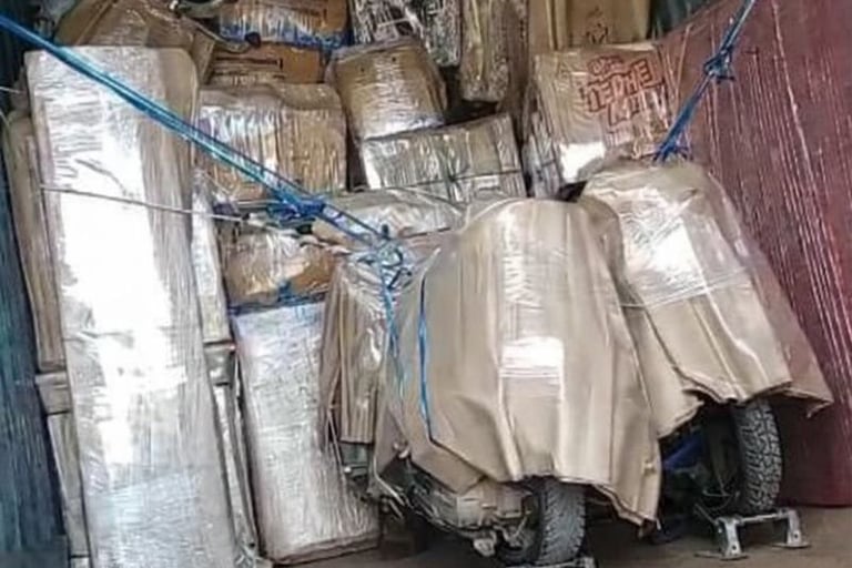 Secure household goods and bike in a transport container by Seemanchal Packers and Movers in Purnia.