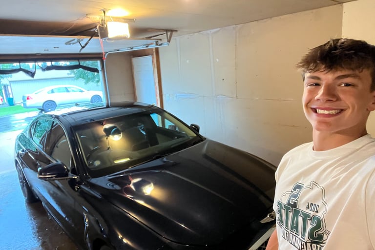 Vehicle exterior waxed and buffed for long-lasting gloss.