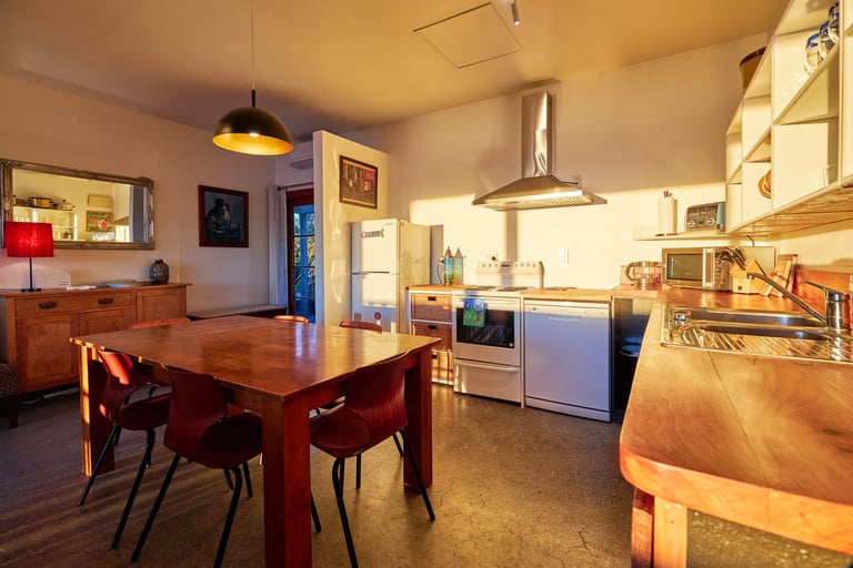 Kitchen and dining area inside The Cottage accommodation in Kaikoura
