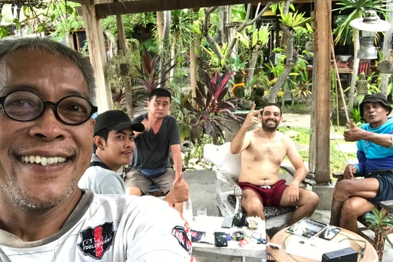 a man with glasses and a white shirt is taking a selfie