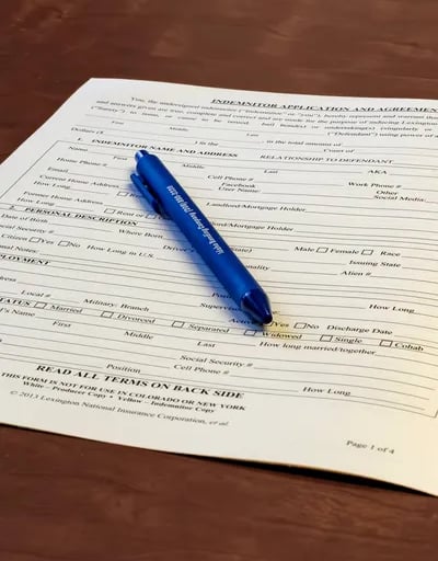 Bail bond application sitting on a table with a pen.
