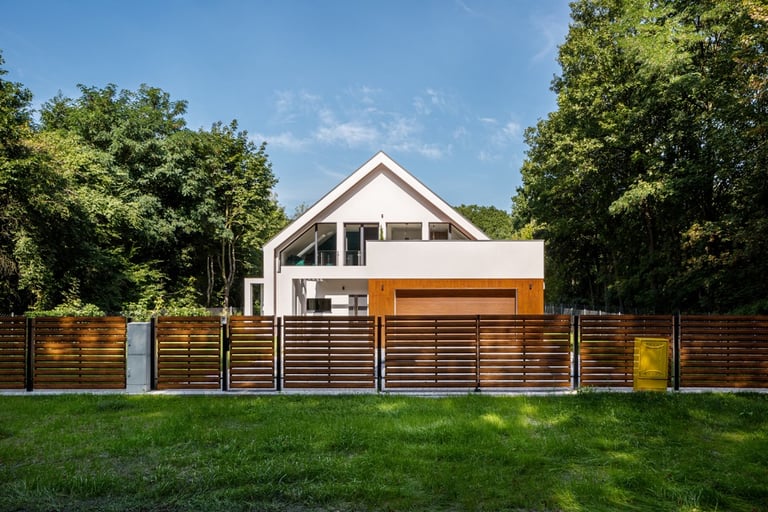 House and neighbour's garden separated by a fence