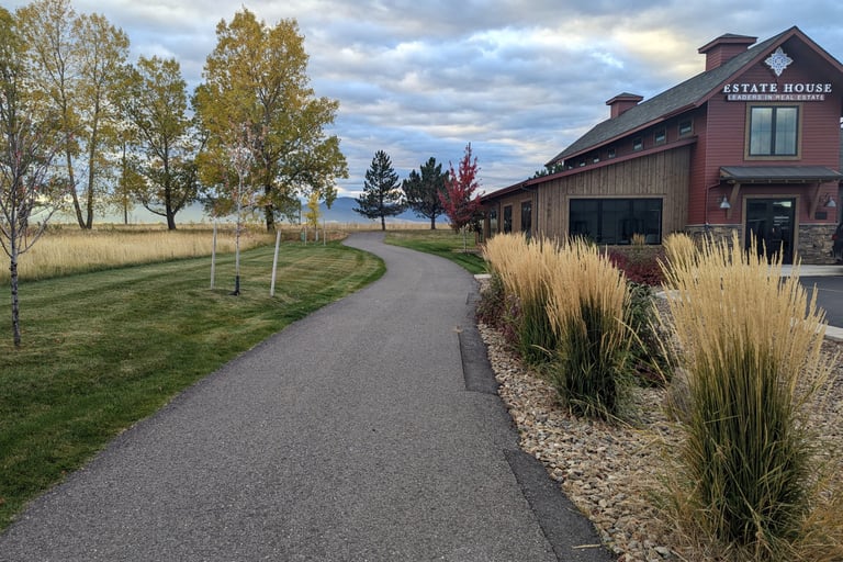 a driveway with a driveway leading to a house