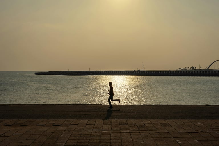 Person running against the background of a harbor Photo by Thilina Alagiyawanna (Pexel.com)