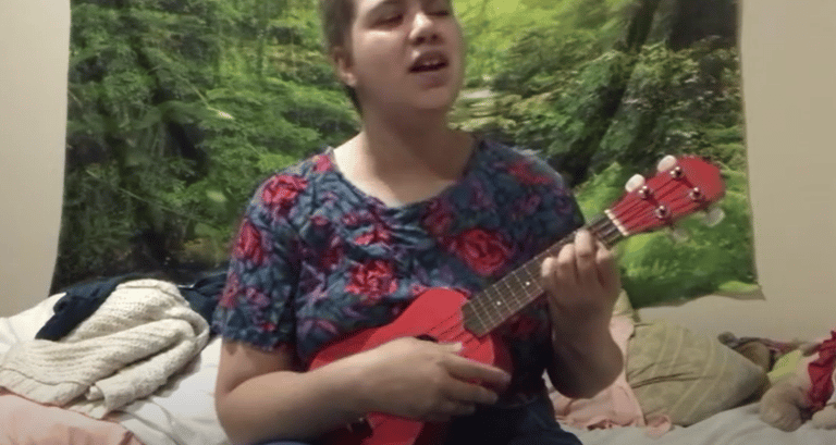 Me, Ella, Holding my ukulele and singing