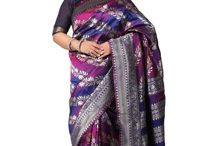 a woman in a multycolor sari 