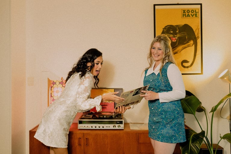 1960s styled brand shoot for Closet Mod Clothing Adelaide. Two models stand with a record player.