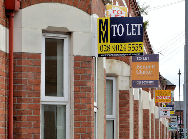 Row of houses with To Let signs.