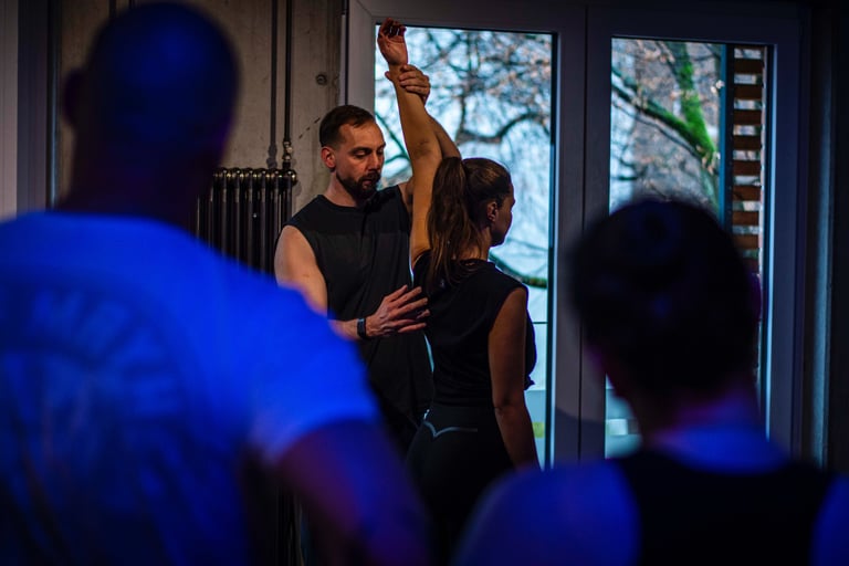 a man and woman dancing in a dance floor