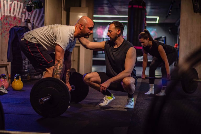 a man and a woman doing a squat - squat
