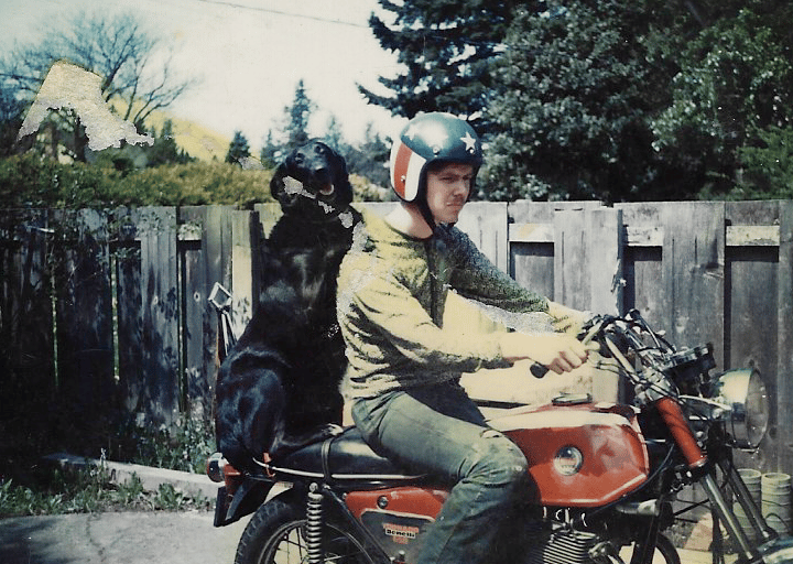 Man and dog on motorcycle