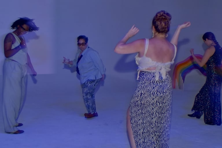 A group of women and queer people dancing at a wedding reception
