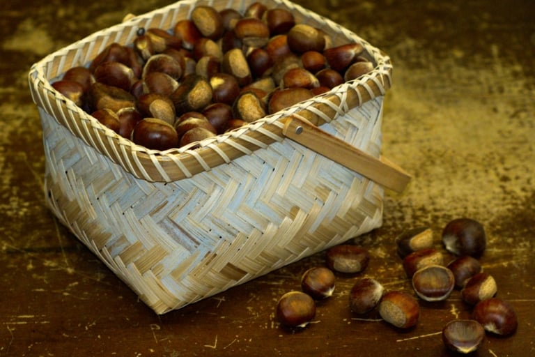 A basket of chestnuts on a brown table