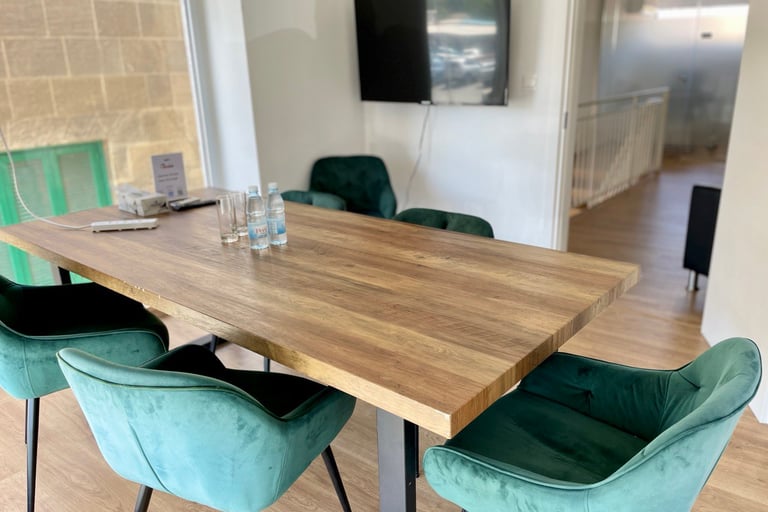 Meeting room, office desk, office chairs, TV