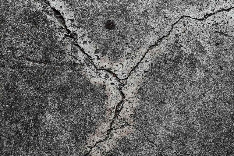 Cracked concrete surface in need of repair and sealing.Fixing and protecting your concrete surfaces.