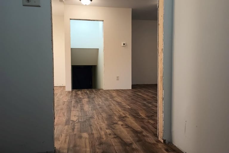 New vinyl laminate flooring was spread throughout this house in Goshen, IN, while being remodeled.