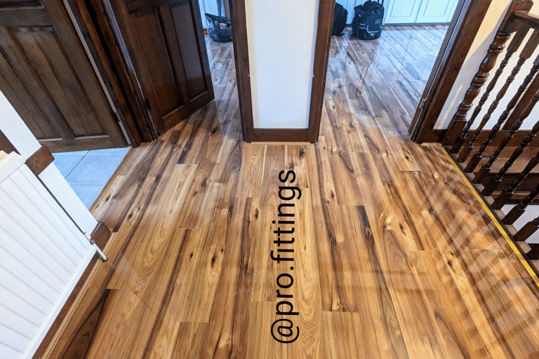 Gloss laminate flooring fitted in Stratford by Pro Fittings Ltd