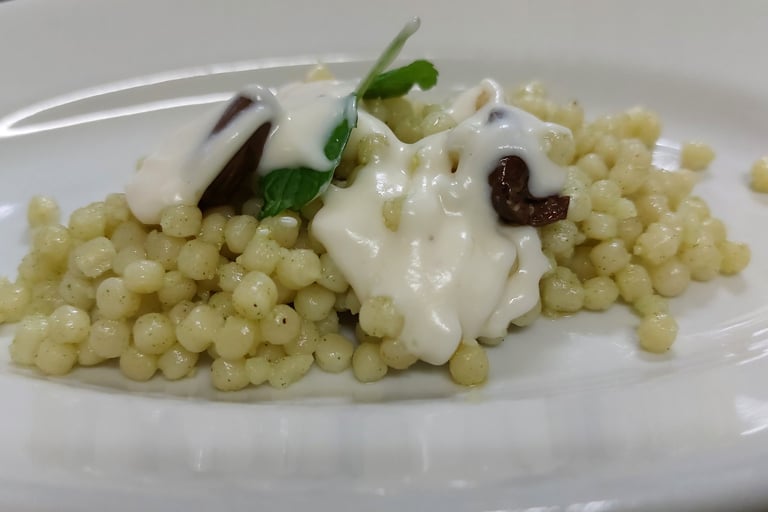Fregula with pecorino cream, traditional Sardinian dish