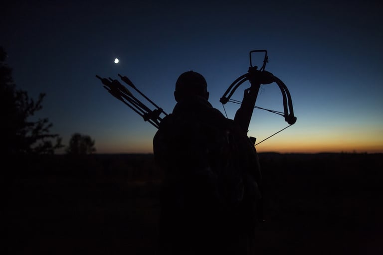 a man holding a bow and a bow