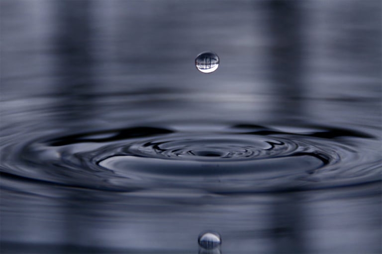 a drop of water in a pool of water