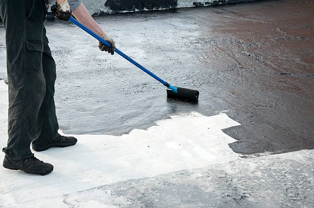 man working on roof substrate